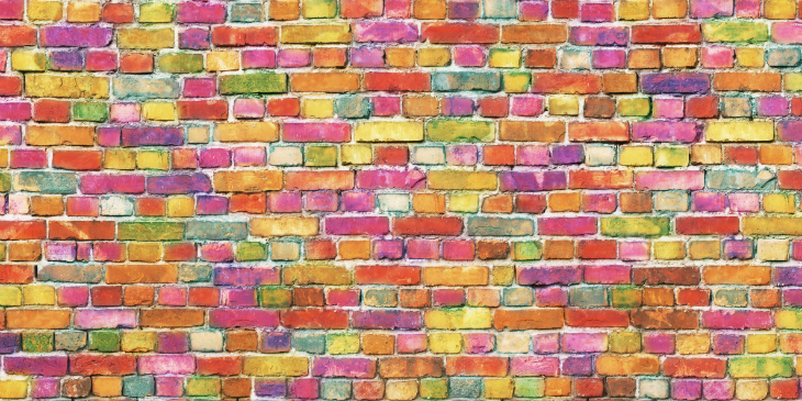 A wall made of differently coloured bricks