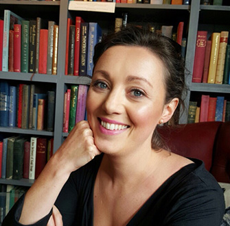 Cornelia Connolly sat down in-front of a bookcase