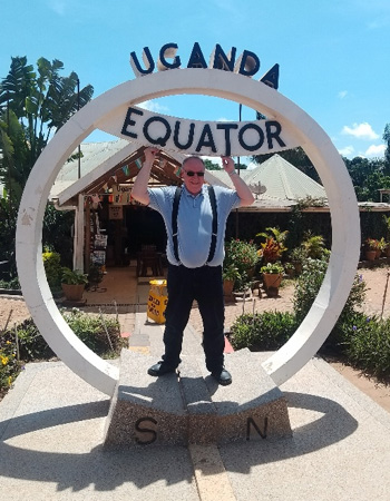 Jeff Fair standing on the Uganda equator line