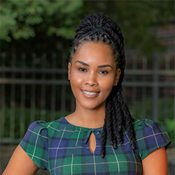 A headshot of Lateefah Id-Deen standing outside