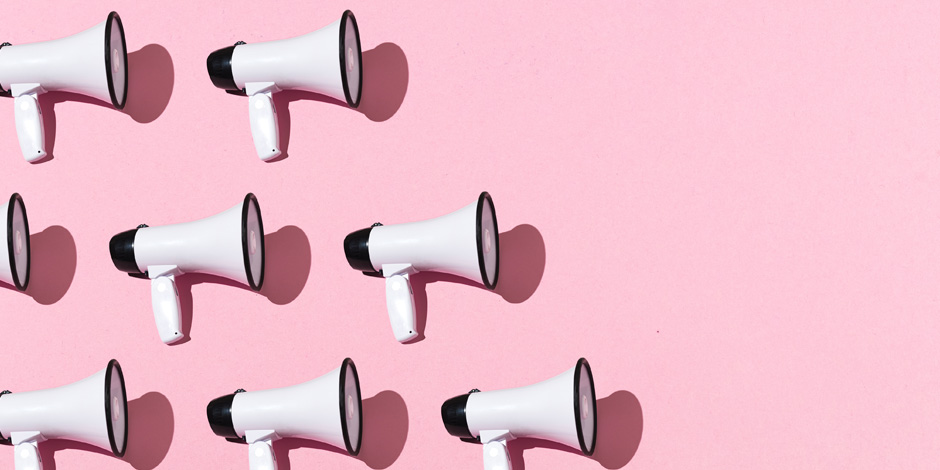 White megaphones pattern with black ornament on pink background on the left side