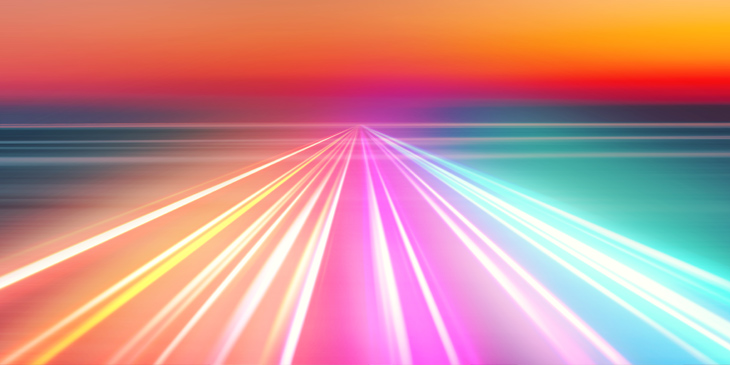 Abstract picture of colorful light trails crossing twilight sky with fast motion