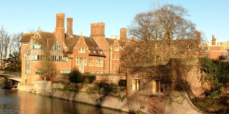 School dorm building set against a river