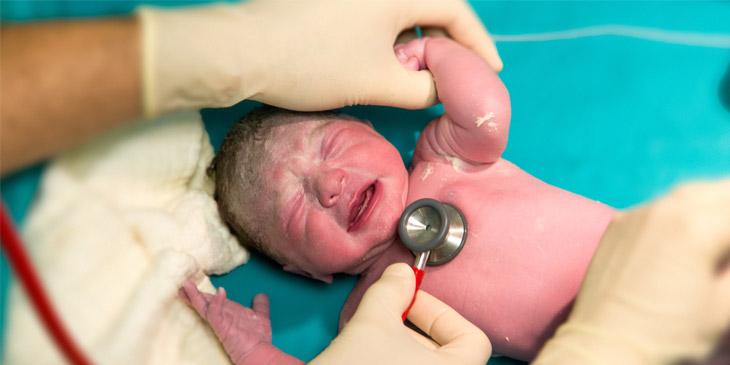 Newborn baby having their heartbeat checked