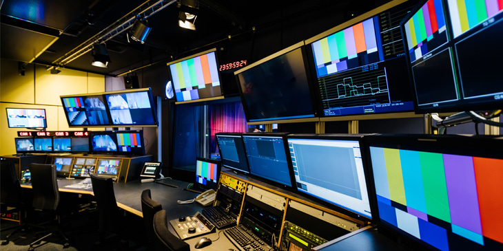 A television production backroom with a range of monitors and controls