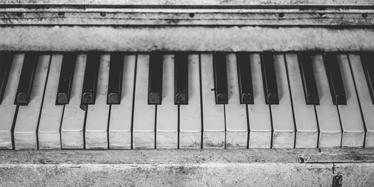 A close up photo of some old piano keys