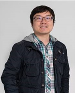 Ouhao Chen posing in-front of a grey background