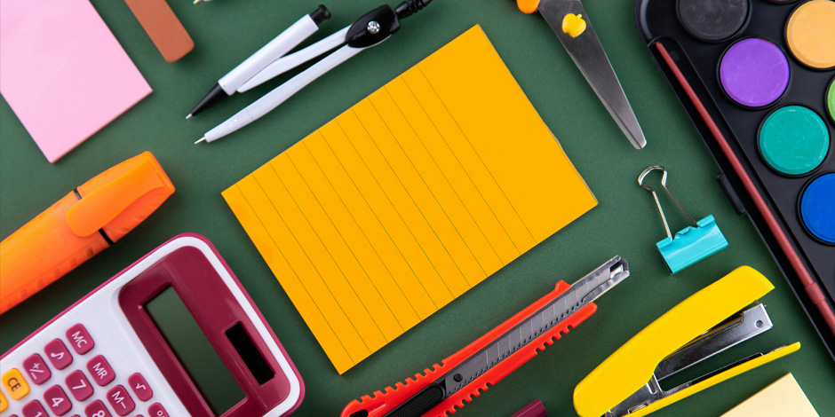 A range of different stationary items layout out on a table