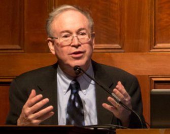 Zalman Usiskin speaking at a podium